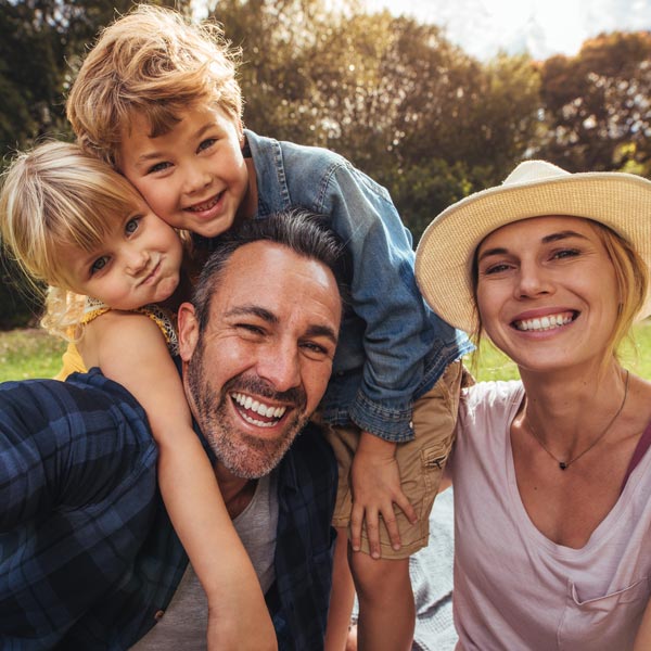 Parents having fun with their kids outdoors at park